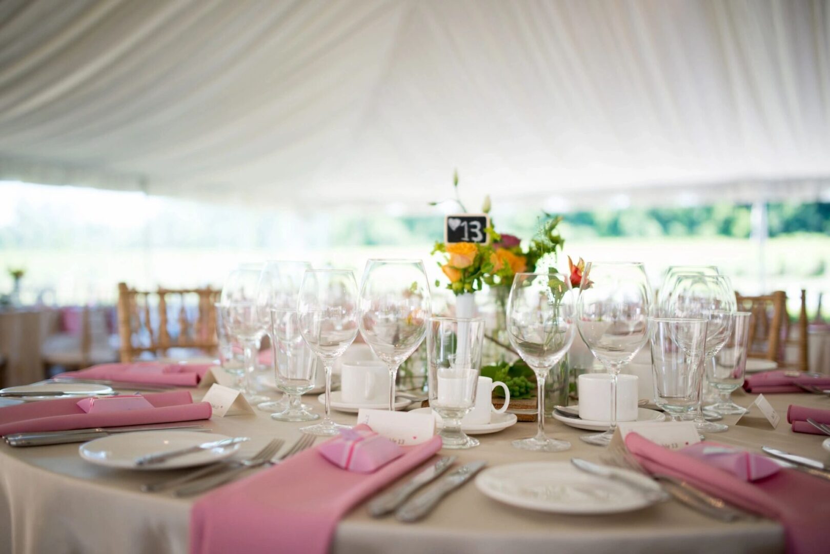 A table set up with plates and silverware.